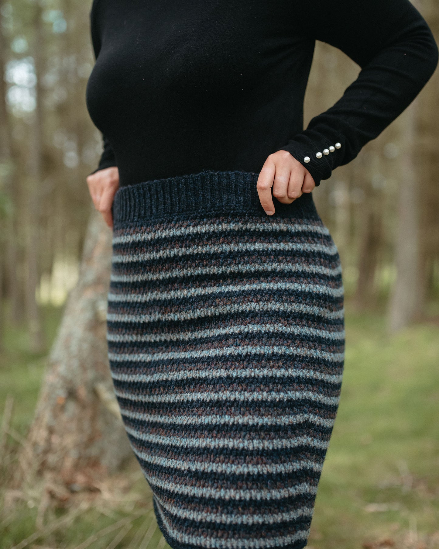 Laminaria is a striped, textural, body hugging, knee-length skirt.